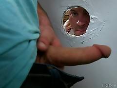 Sean turns around and notices that he went behind the stall so he slowly walks up to the glory hole and peeks in to see Aspen stroking his sexy cock.